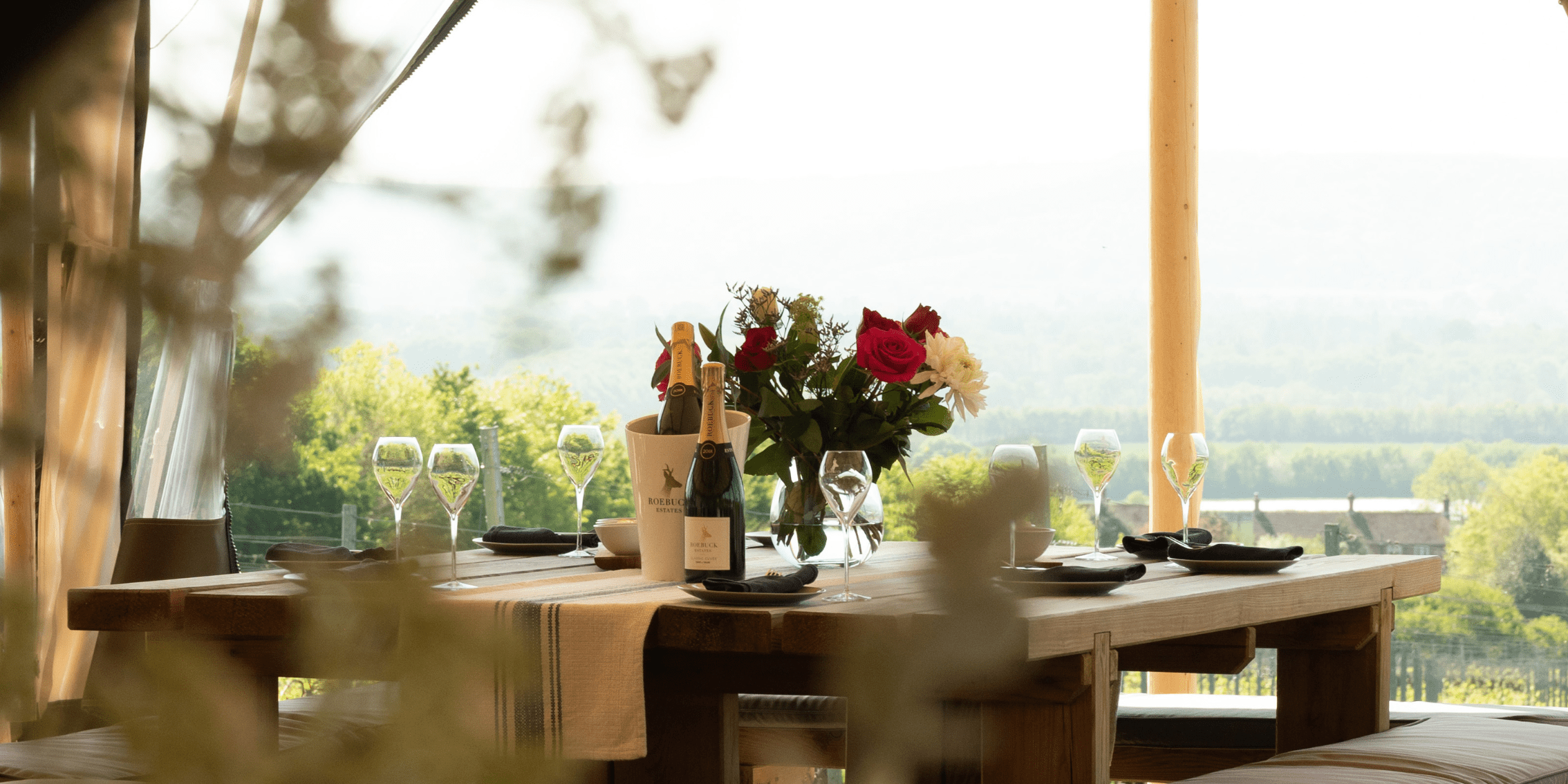 Dining table with wine glasses on it.